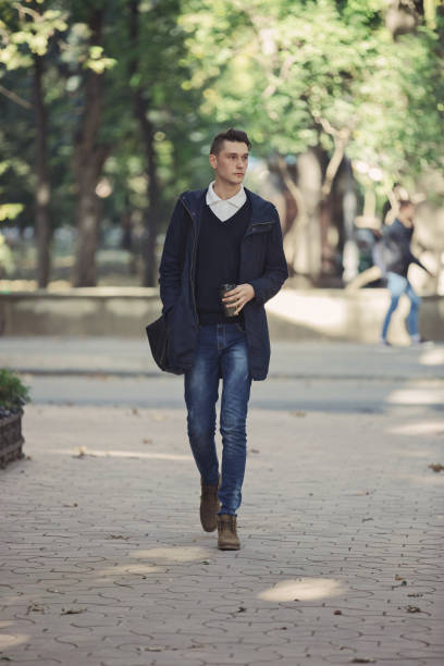 istock Hipster man walking in the streets 653164230