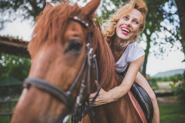 istock Girl loves horses 653164370