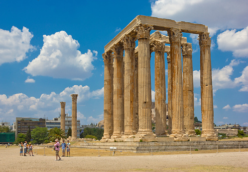 Athens, Greece - July 11, 2013: Olympieion (the Temple of Olympian Zeus) with sightseeing people