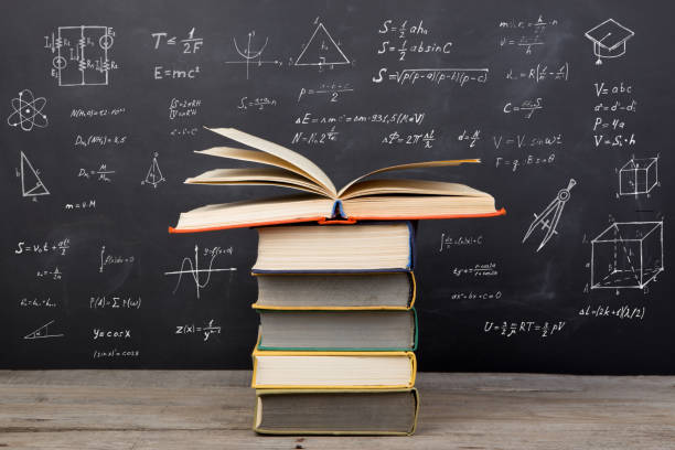 istock Education concept - books on the desk in the auditorium 653171028
