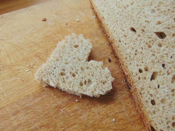 istock Bread with heart cut out of slice 653183506