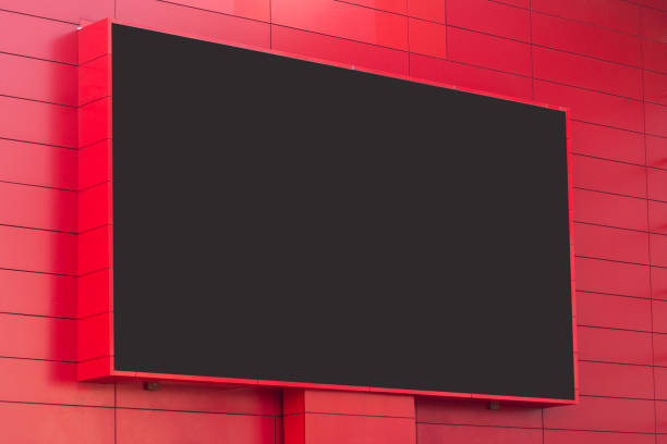 outdoor digital display on red wall horizontal front view of outdoor digital display with blank screen on red building exterior wall high street shops stock pictures, royalty-free photos & images