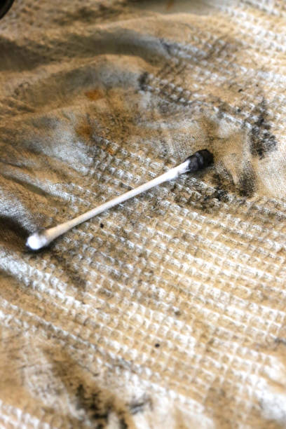 istock Removing Carbon with Cotton Swab 653187344