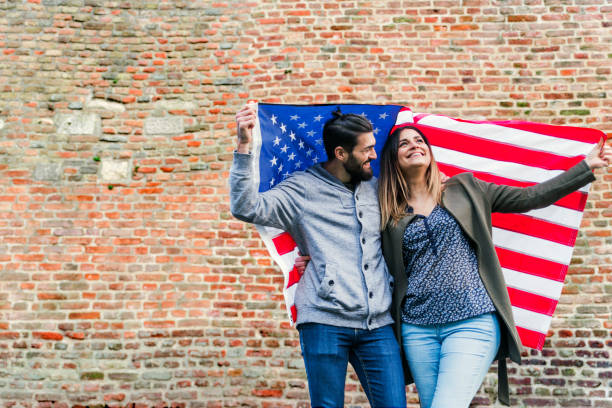 istock Young couple with American flag 653188264