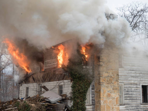 istock smoke and flames coming from house 653188390