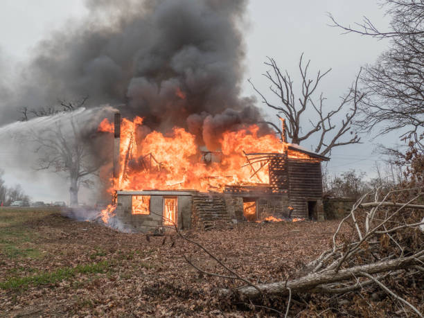 istock fire fighters trying to control house fire 653188482