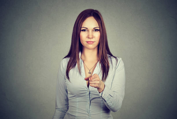 istock business woman pointing finger at camera 653188962