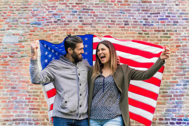 istock Couple  having fun over american flag background 653191160