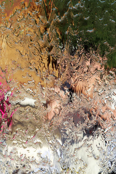 istock Water flows along the wall of the mirror, vertical abstract background, shiny texture 653194478