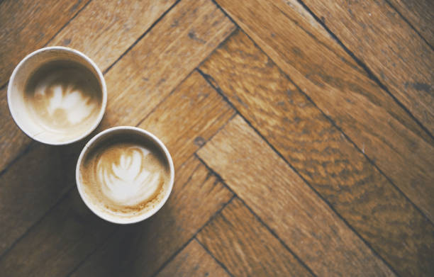 istock Two coffees on a floor background and a warm atmosphere 653194856