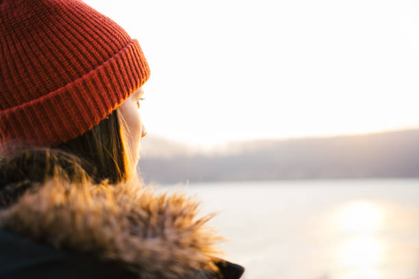 istock Hipster woman enjoy winter sunset 653194972