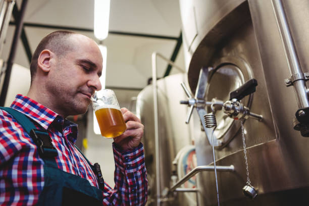 istock Manufacturer smelling beer at brewery 653195702