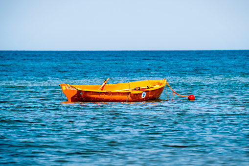 Rescue boat floating in the sea in natural light.