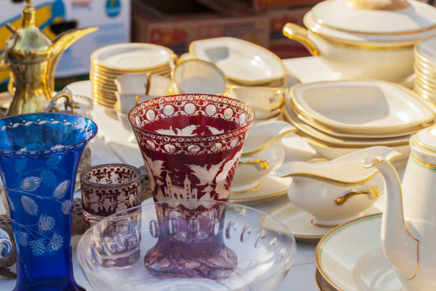 istock China and  glassware at an outdoor second hand market. 653199010