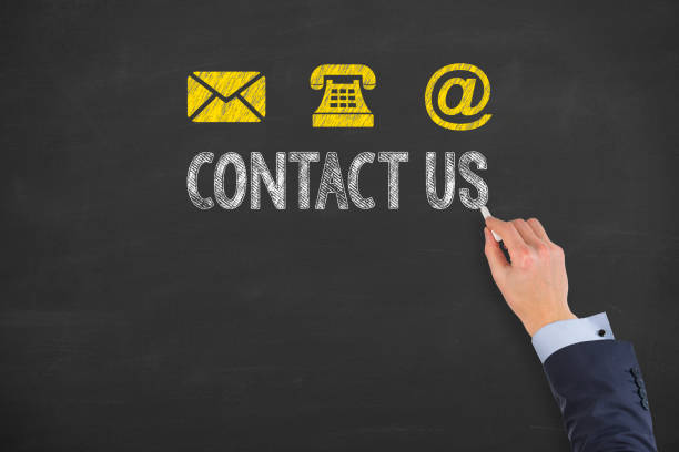 istock Human Hand Drawing Contact Us on Blackboard 653199028