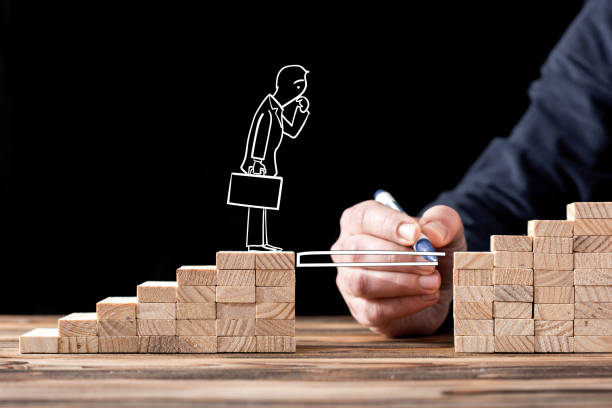 istock Career Planning Concept. Businessman Getting Help Building Bridges To Success. 653202080