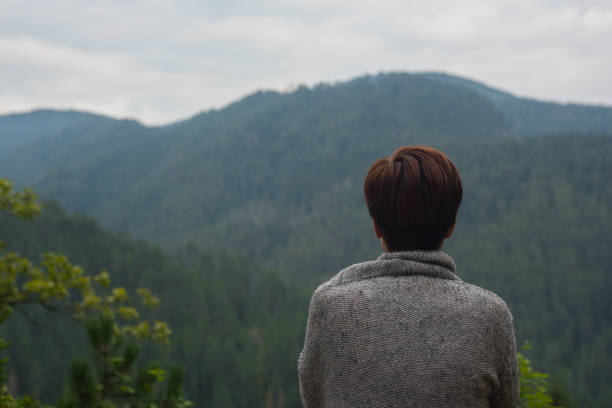 istock Woman Gazes at Mountains During a Chilly Afternoon 653211864