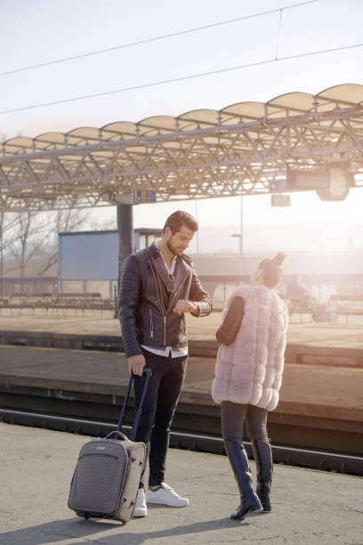 istock Young couple on a railroad station 653214814