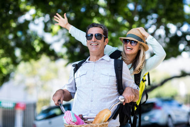 istock Cheerful couple riding bicycle 653218184