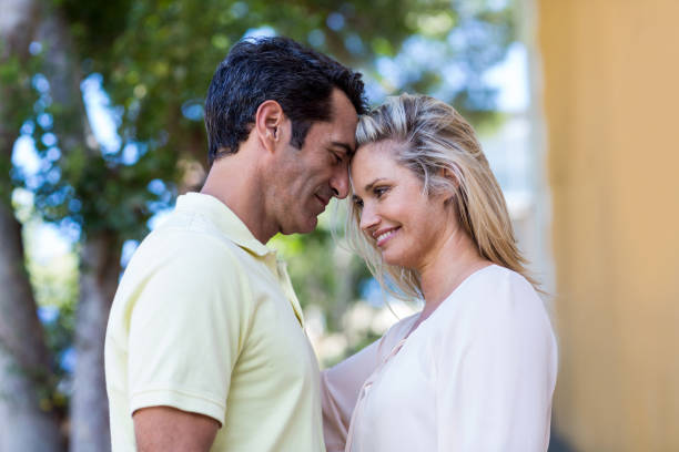 istock Romantic couple standing by building 653218616