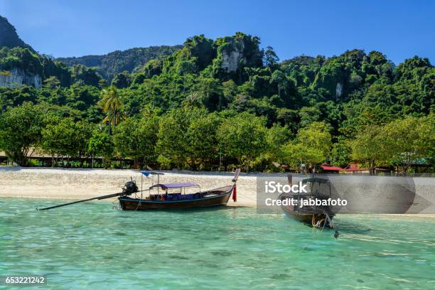 Traditional Thai Two Boat On The Beach Of Phi Phi Island In Thailand Stock Photo - Download Image Now