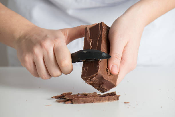 istock Mixed race woman chopping chocolate 653221576