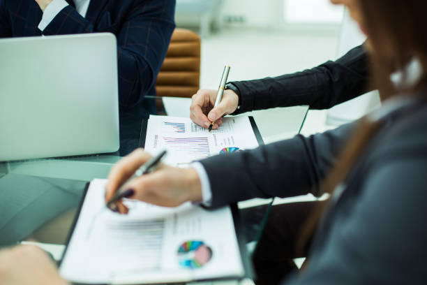 istock business team discussing financial charts on a workplace 653221748