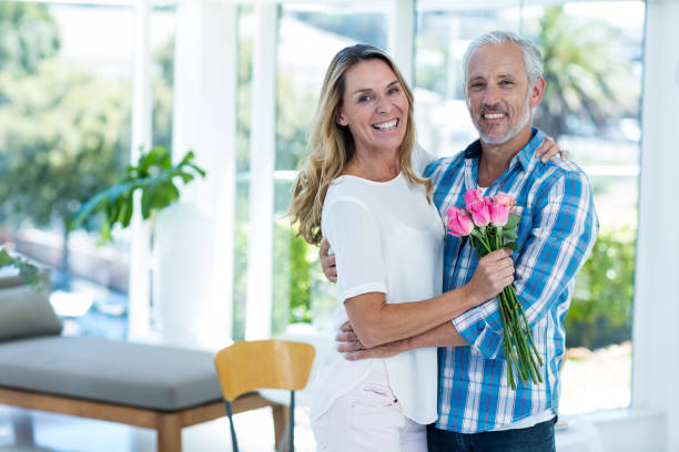 istock Mature couple embracing in restaurant 653231938