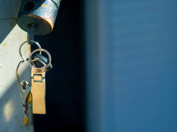 Old Locks With Keys On Garage Door Stock Photo - Download Image