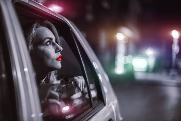 istock Beautiful young girl looking through window 653237380
