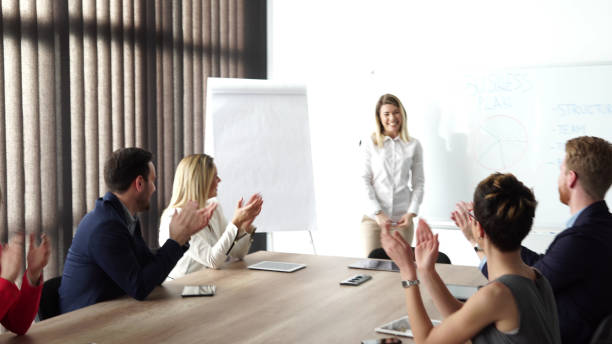 istock Young businesswoman holding presentation 653238696