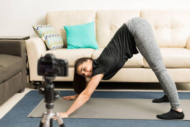 istock Blogger demonstrating yoga pose on video 653241486