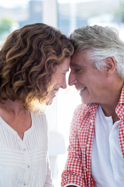 istock Smiling romantic couple in restaurant 653244778