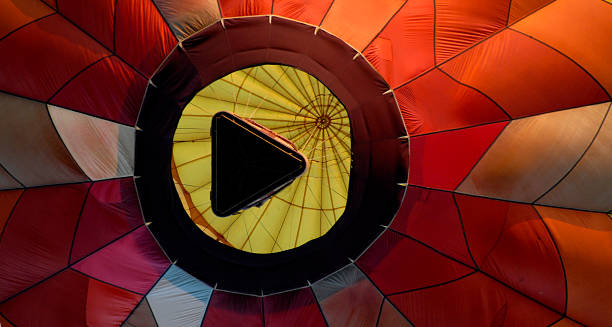 Hot Air Balloon from Beneath looks like Play Button A hot air balloon shot  looking directly up.. Also a visual pun for the video "play" button used to start videos on the web. play button photos stock pictures, royalty-free photos & images