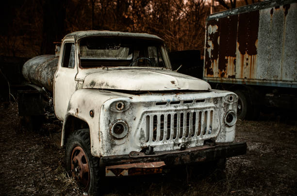 istock Old rusty truck abandoned at the in the woods 653251136