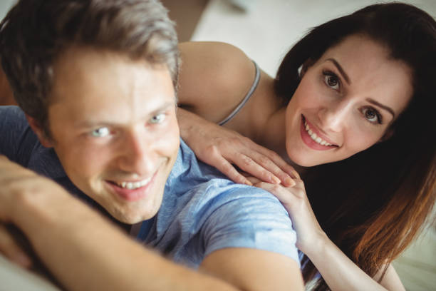 istock Romantic couple relaxing on bed 653251420