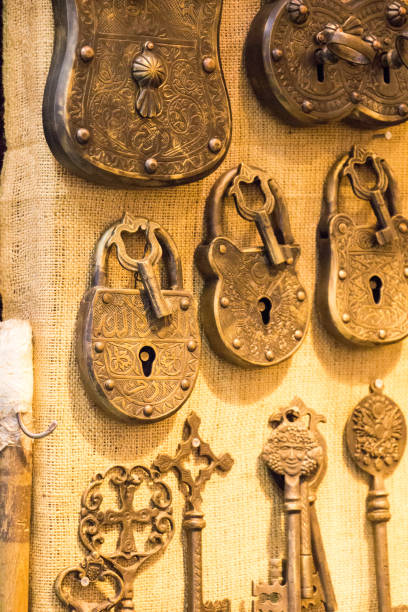 istock Retro styled keys and locks hanging on a wall 653254532