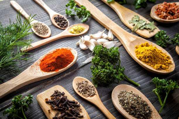 istock Various spice on wooden spoons with herbs 653257956