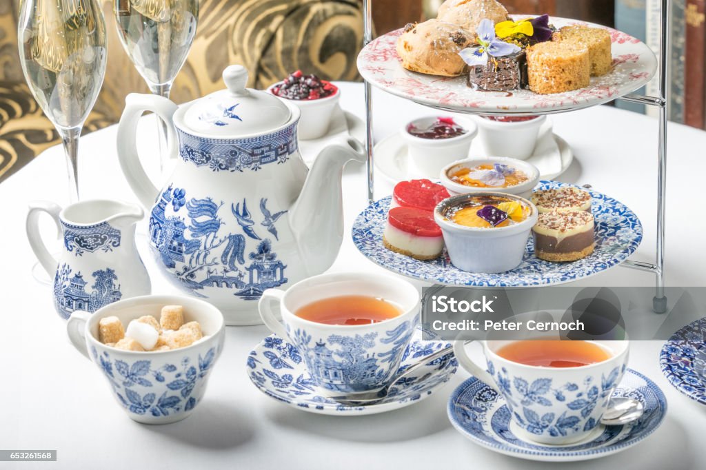 afternoon tea set Tea at five luxury sweets cake dessert sandwich china teapot hotel aftrnoon Tea Party Stock Photo