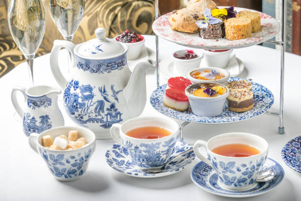 afternoon tea set Tea at five luxury sweets cake dessert sandwich china teapot hotel aftrnoon scone photos stock pictures, royalty-free photos & images