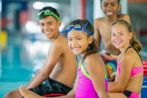 istock Children at a Swimming Lesson 653266956