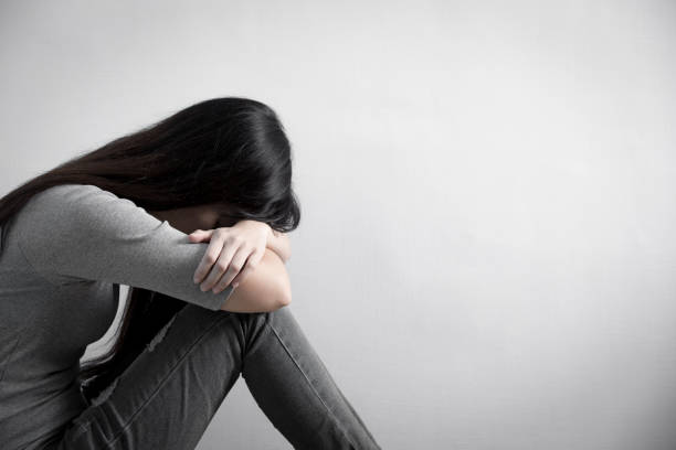 istock depression woman sit on floor 653267630