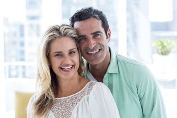 istock Smiling romantic couple at home 653271154