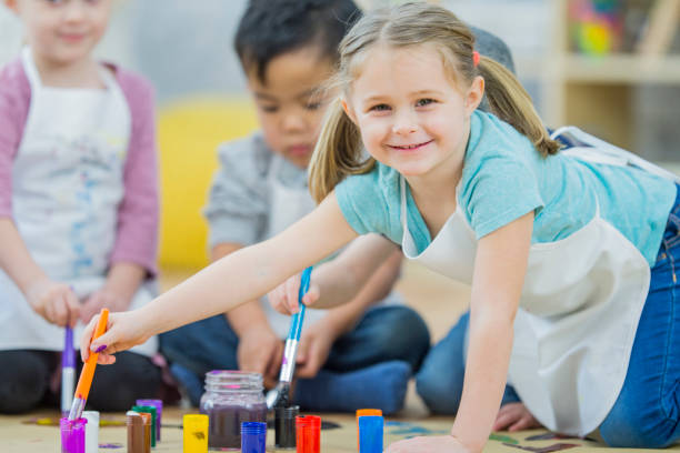 istock Preschoolers Painting Together 653274682