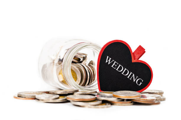 istock Glass jars with coins and Savings Wedding 653277474