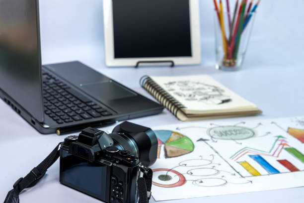 istock Camera, laptop, tablet, business illustration on desk/ Office still life 653280652
