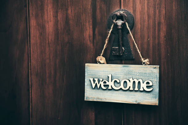 istock Wooden welcome sign with flower border 653281230