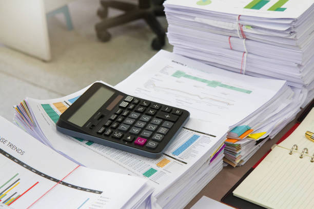 istock Business Concept, Pile of unfinished documents on office desk 653281528