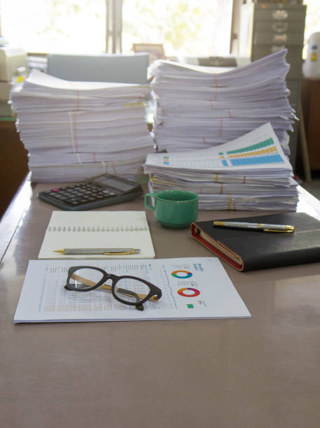 istock Business Concept, Pile of unfinished documents on office desk 653281584