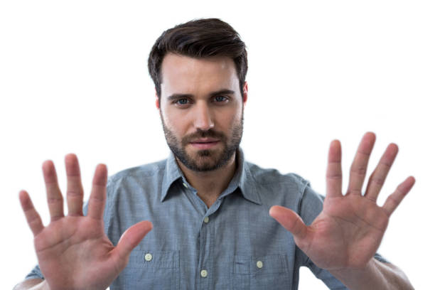 istock Man pretending to touch an invisible screen 653284286